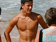 Australian gay teens at the beach in their speedo swimwear.