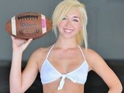 Sporty blonde cutie demonstrates that she is sexy and loves football