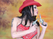 Very pretty mega cock shemale beauty takes her red cowgirl costume out