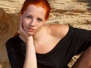 Stunning redhead girl exposes her super ass and tits outdoors