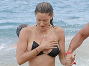 Jill Wagner sexy in black bikini on the beach in Maui