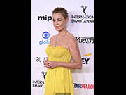 Connie Nielsen in yellow dress at 51st International Emmy Awards in New York
