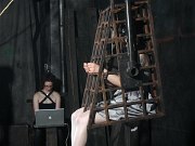 Mei Mara petite in white stockings bound in metal cage by lezdom