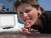 Skinny blonde mature is sucking small dick on a yacht until man cum