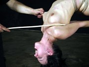 Elise Graves in rope bondage is spanked and naked body exposed